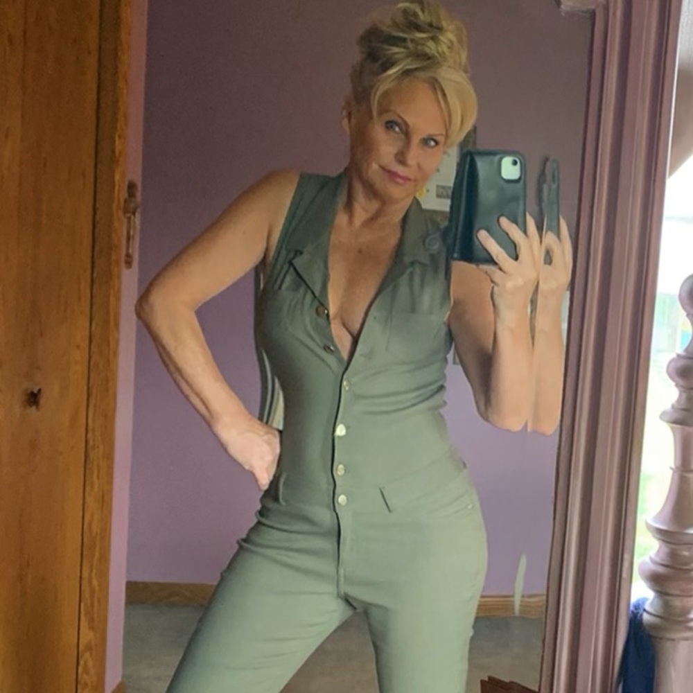 Army green jumpsuit with red strapped platforms